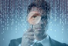 13709882-young-businessman-zooming-on-a-binary-code-on-a-monitor-with-a-magnifying-glass.jpg